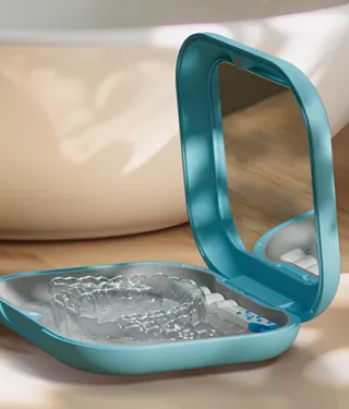 Image of a Spark Clear Aligner in its Custom Hard Case sitting on a counter top