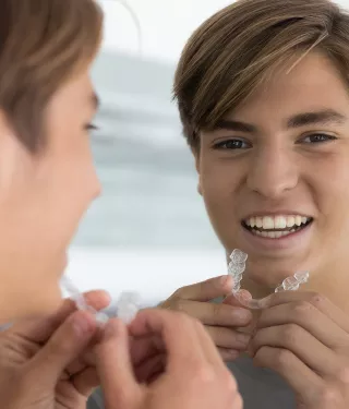 Person putting in Clear Aligners