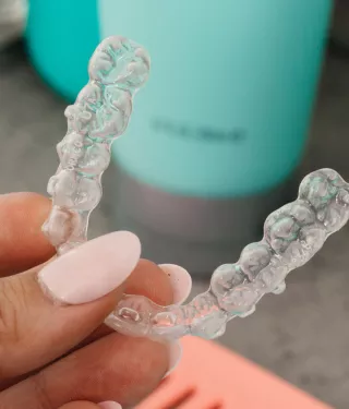 Spark Clear Aligners in hand banner