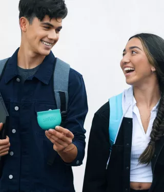 Teen couple walking with Spark Aligners