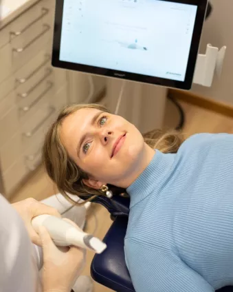 woman smiling at the orthodontist