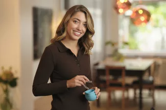 Woman holding clear Aligners