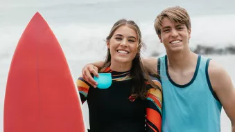Teen surfing Clear Aligners