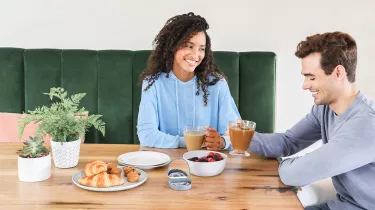 Couples with Spark Aligners during breakfast